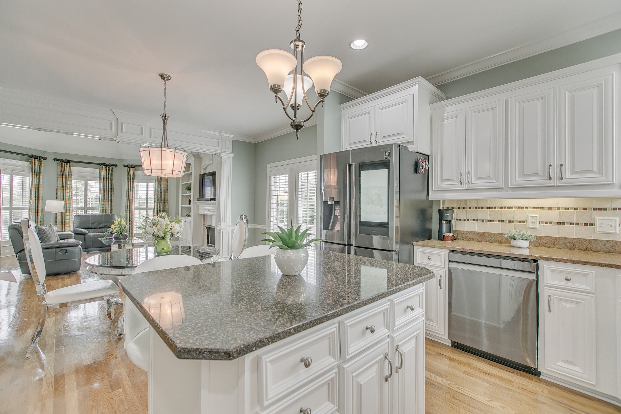 2613 Sequoya Trace Murfreesboro, TN 37127 - Photo 12 of 48 a kitchen with center island a sink a center island a dining table and chairs