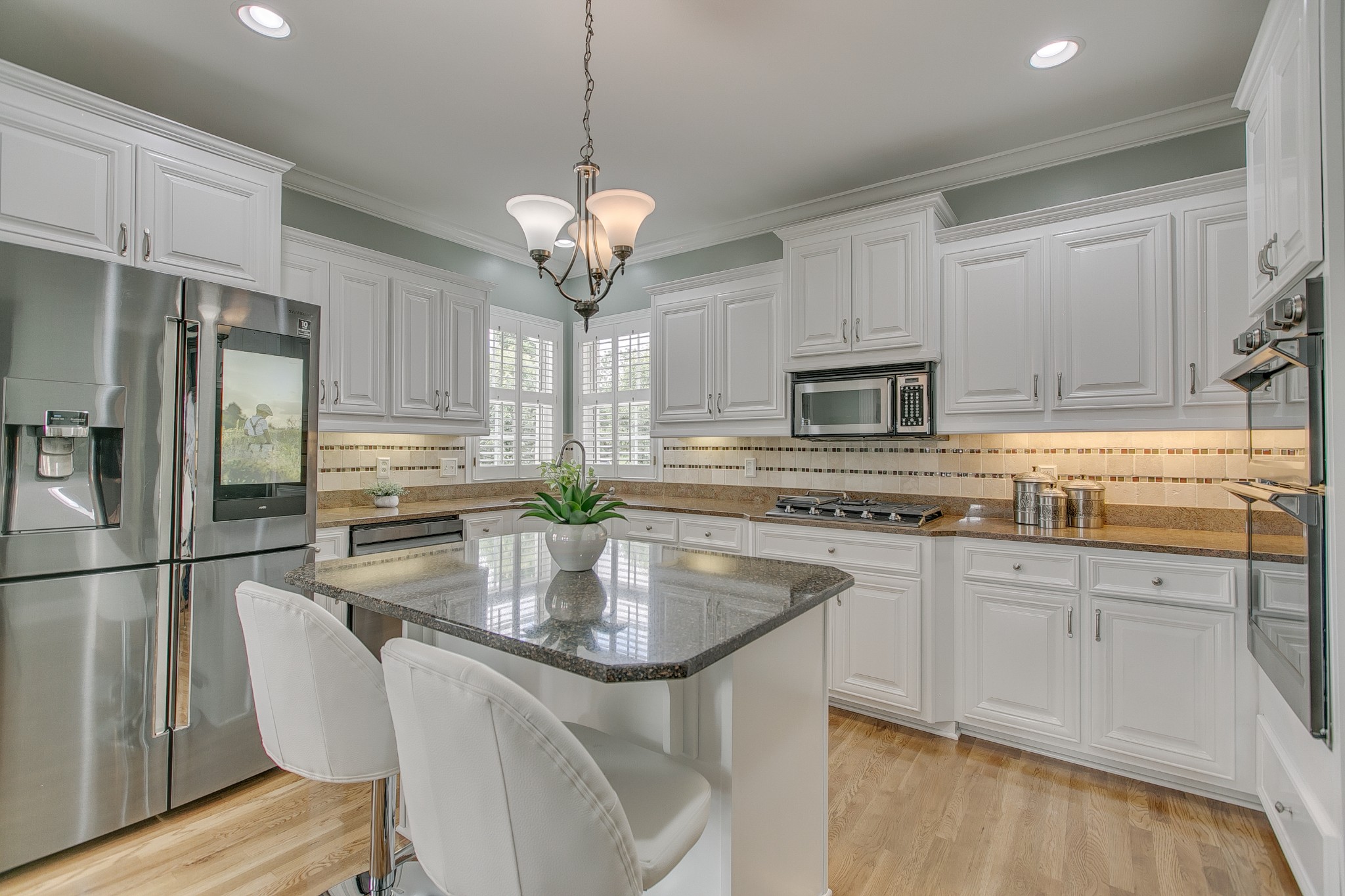 2613 Sequoya Trace Murfreesboro, TN 37127 - Photo 10 of 48 a kitchen with stainless steel appliances granite countertop a sink a stove a refrigerator cabinets and chairs
