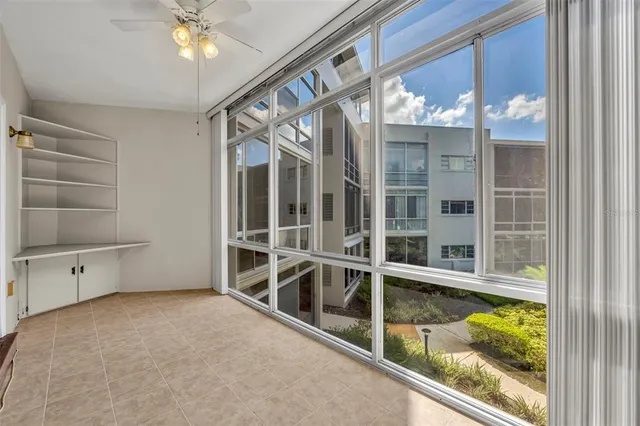a view of a floor to ceiling window and a swimming pool