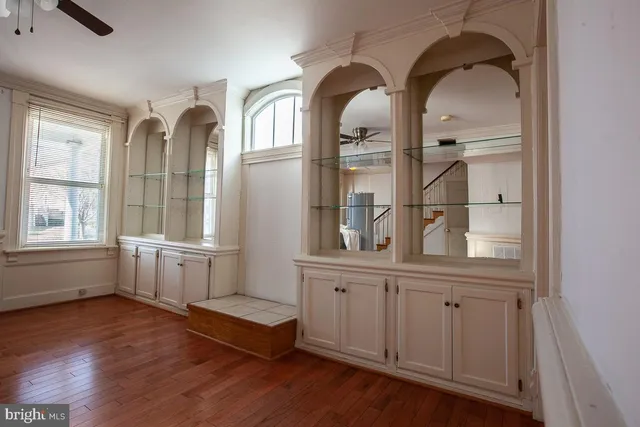 a living room with wooden floors