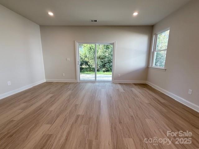 211 Queens Court Gastonia, NC 28052 - Photo 17 of 48 an empty room with wooden floor and windows