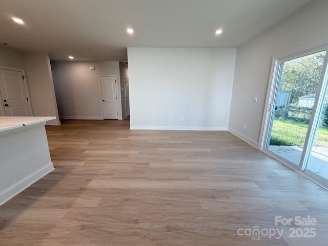 211 Queens Court Gastonia, NC 28052 - Photo 21 of 48 a view of an empty room with wooden floor and a window