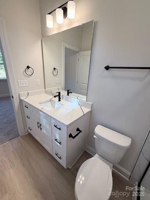 211 Queens Court Gastonia, NC 28052 - Photo 46 of 48 a spacious bathroom with a toilet sink and mirror