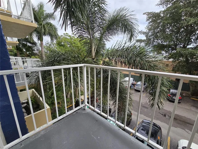 a view of a balcony with furniture