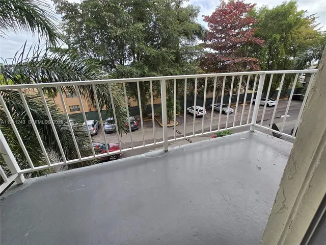 a view of balcony with furniture