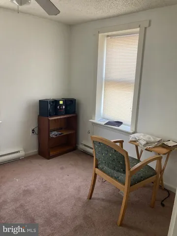 a room with a table and windows