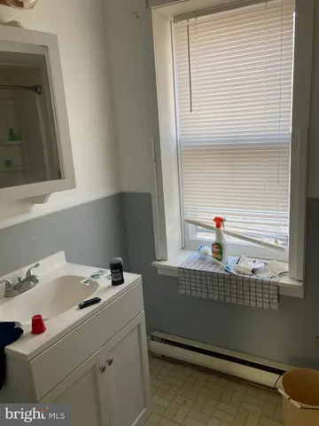 a bathroom with a sink and a washing machine
