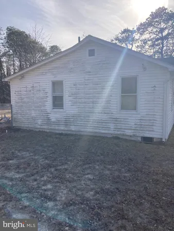 a view of a backyard of the house