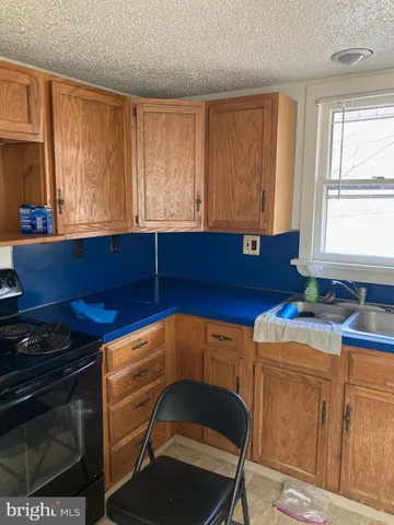 a kitchen that has a sink and a stove