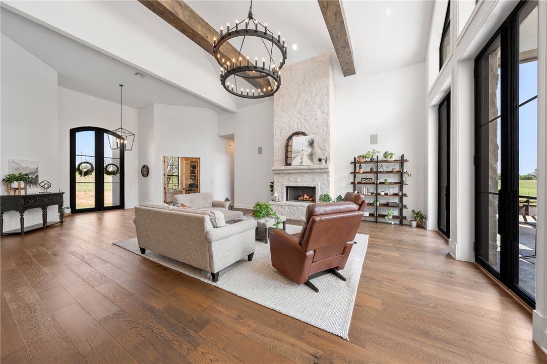 1351 River Road Waco, TX 76705 - Photo 11 of 96 a living room with furniture a flat screen tv and a wall clock