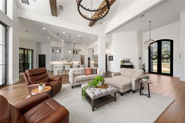 a kitchen with granite countertop white cabinets and stainless steel appliances