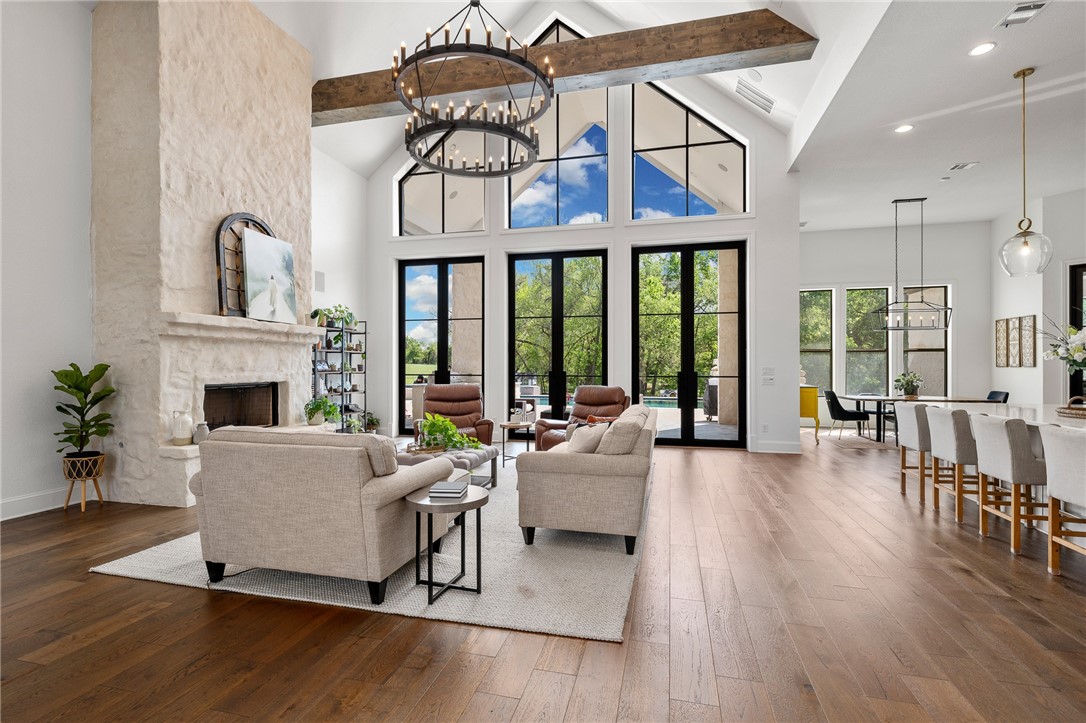 1351 River Road Waco, TX 76705 - Photo 2 of 96 a living room with furniture a fireplace and wooden floor