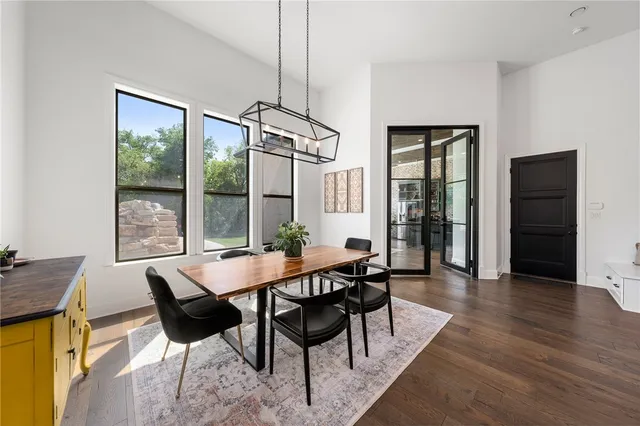 a living room with furniture and a book shelf