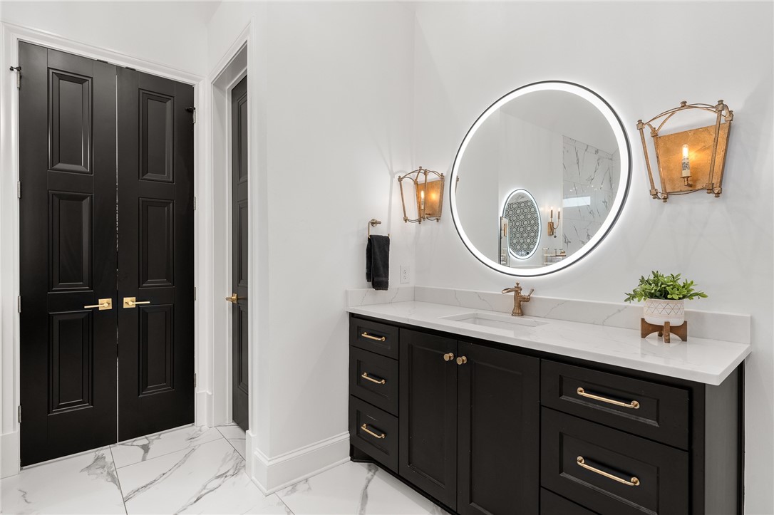 1351 River Road Waco, TX 76705 - Photo 26 of 96 a bathroom with a sink and a mirror