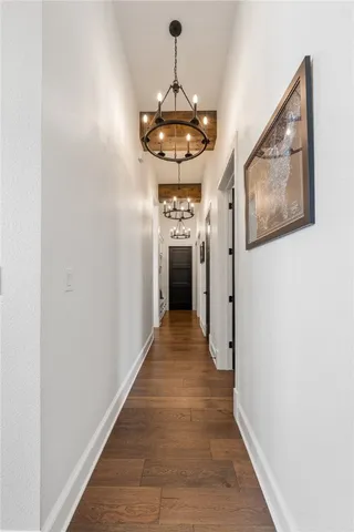 a view of a brick house with chairs in front of building