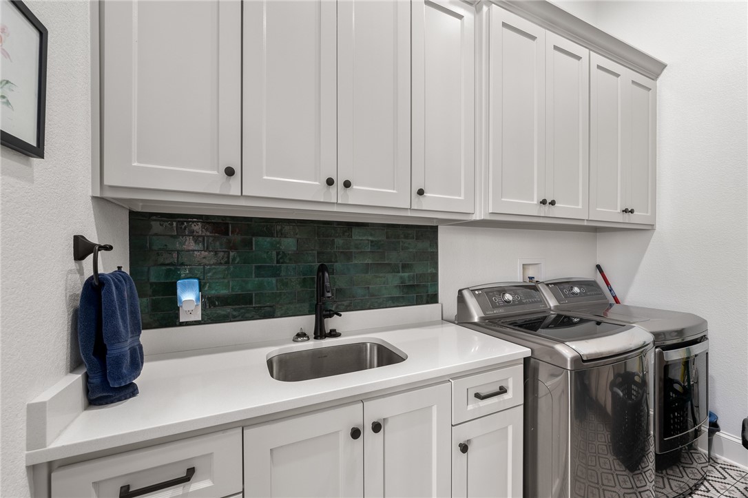 1351 River Road Waco, TX 76705 - Photo 40 of 96 a kitchen with a sink and cabinets