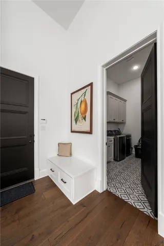 a aerial view of a house with swimming pool table and chairs