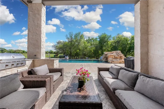 a view of grassy field with trees