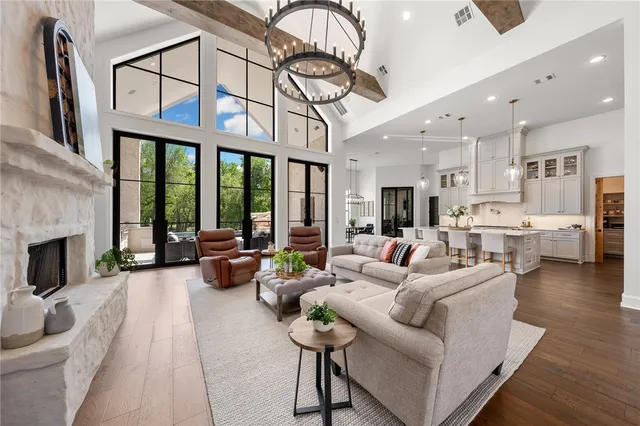 a kitchen with a sink dishwasher a stove and a refrigerator with wooden floor