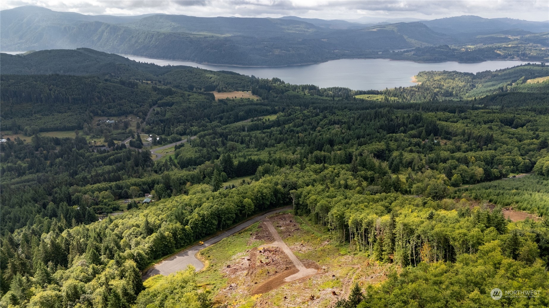 347 Short Road Morton, WA 98356 - Photo 4 of 16 a view of a lake with mountains in the background