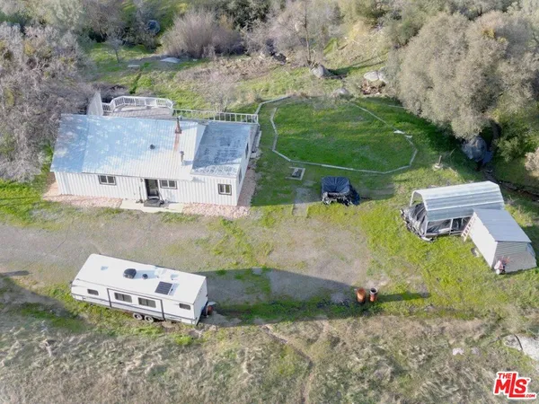 an aerial view of a house with outdoor space