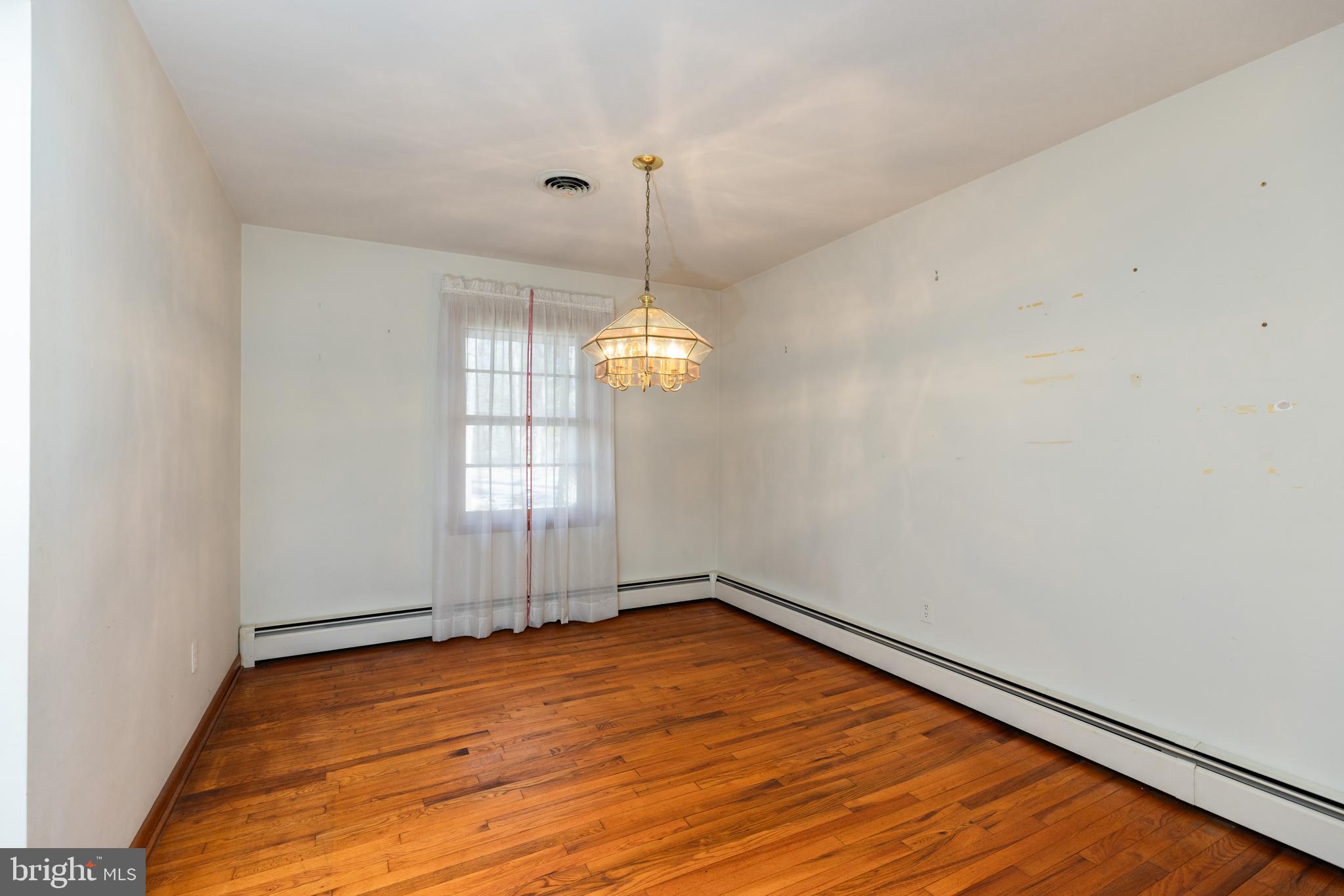 31360 Point Circle Lewes, DE 19958 - Photo 11 of 42 a view of empty room with wooden floor and fan