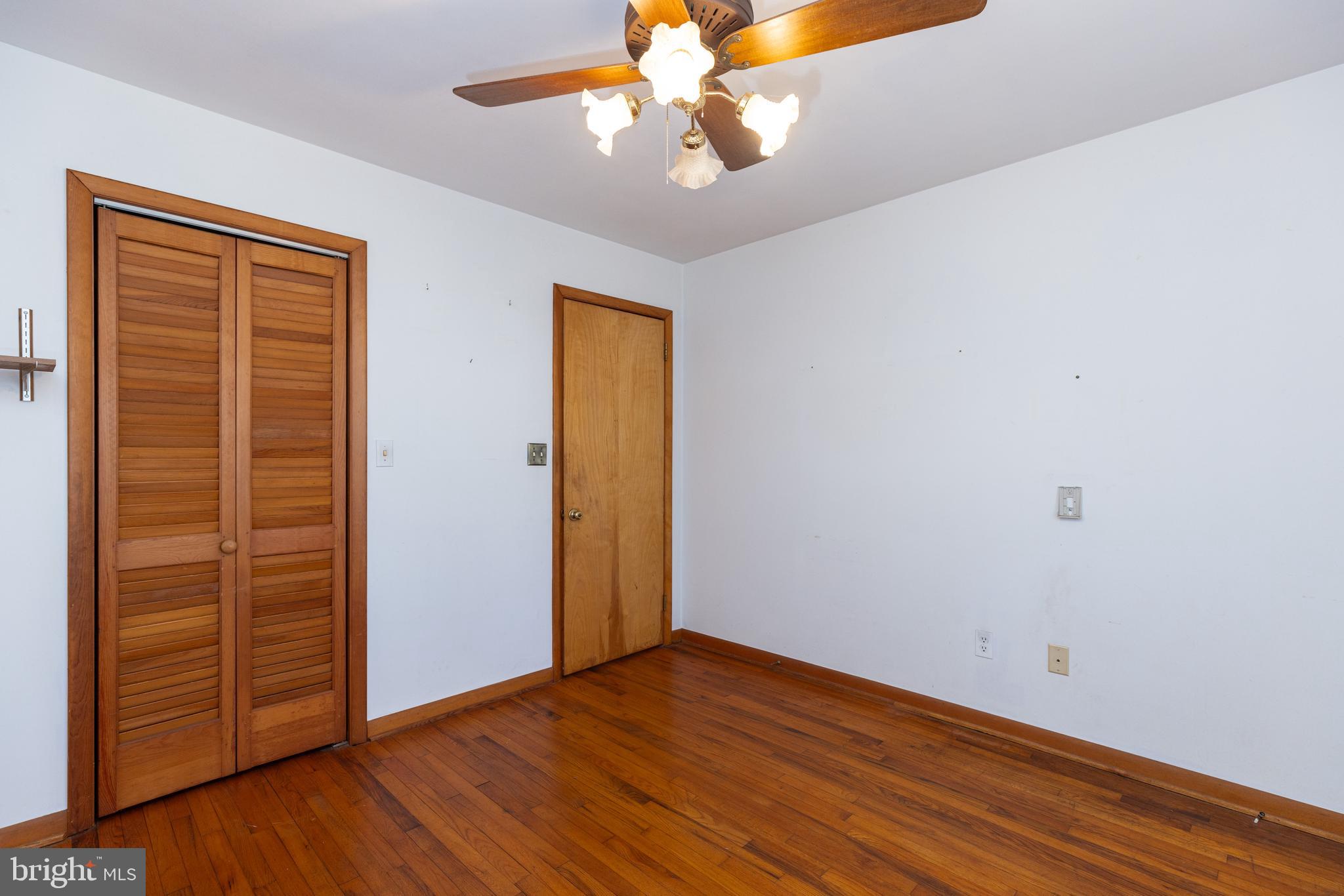 31360 Point Circle Lewes, DE 19958 - Photo 10 of 42 wooden floor in an empty room with a window