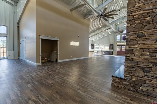 a view of an entryway with wooden floor