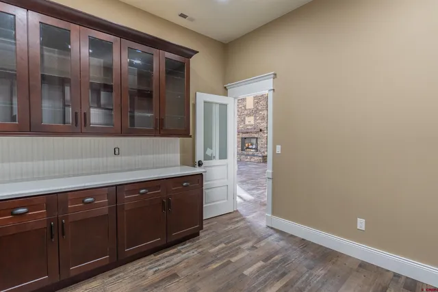 a view of cabinets and wooden floor