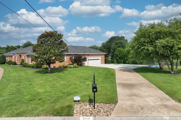 a view of a house with a back yard