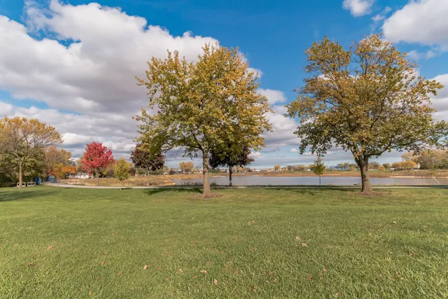 a swimming pool with outdoor seating and yard