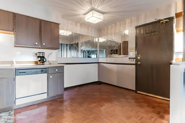 a kitchen with stainless steel appliances granite countertop a sink a stove a refrigerator and cabinets