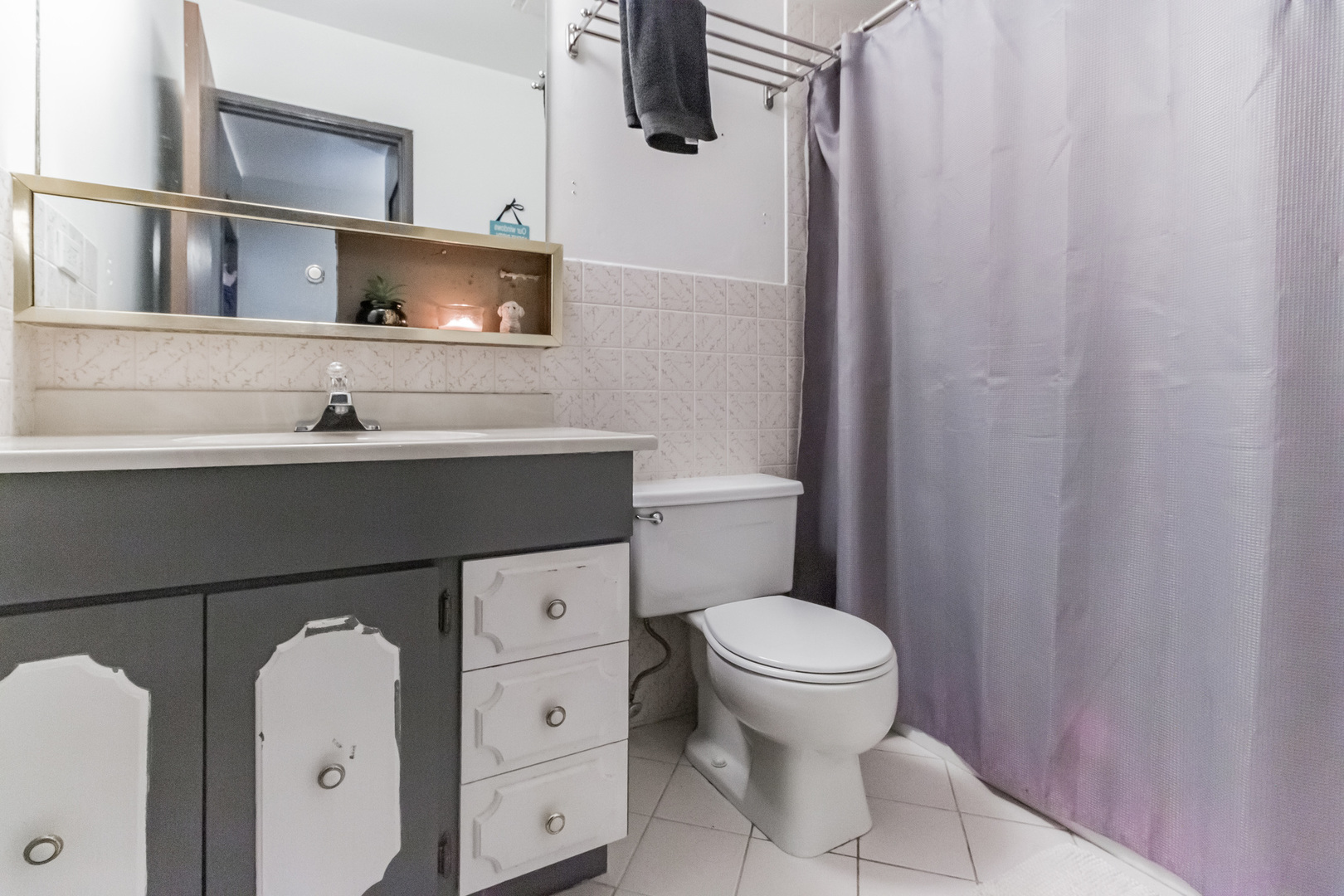 310 George Street, Unit 2SE Bensenville, IL 60106 - Photo 7 of 11 a bathroom with a sink toilet and mirror