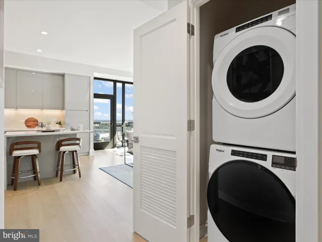 a view of a hallway with washer and dryer