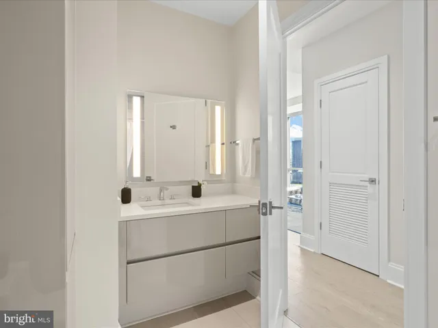 a bathroom with a double vanity sink mirror and double