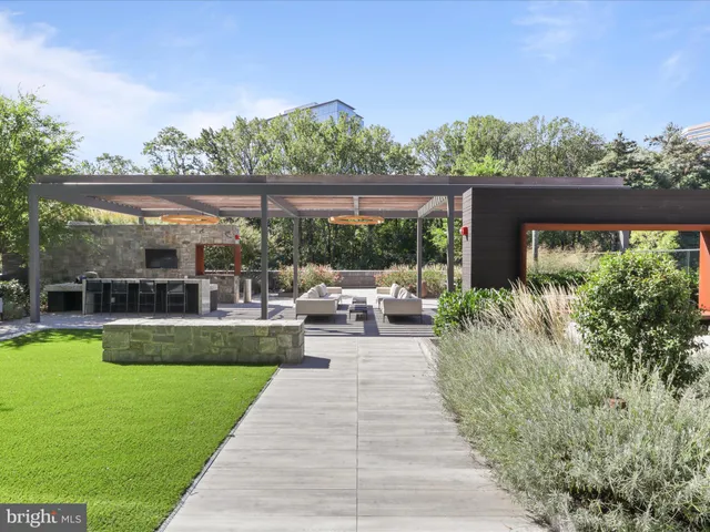 a view of a patio with couches table and chairs