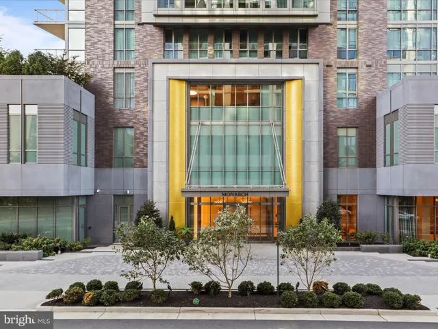 a front view of a building with a yard