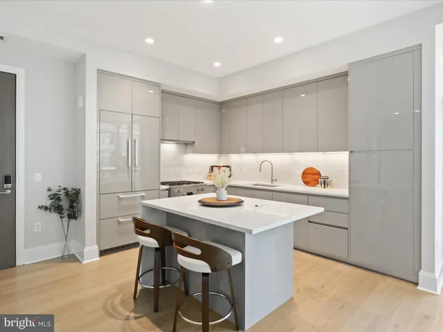 a view of a kitchen with a table and chairs