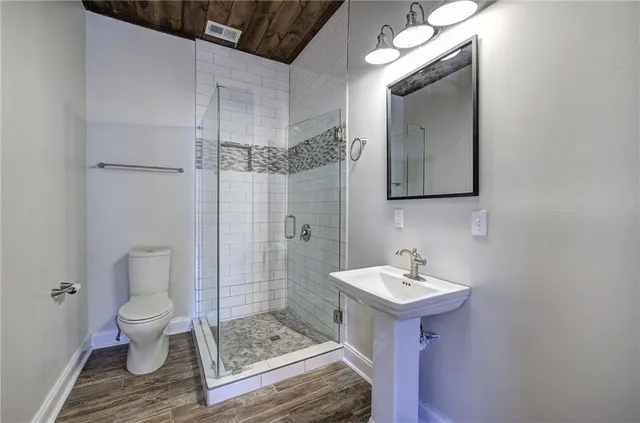 a view of hallway with wooden floor