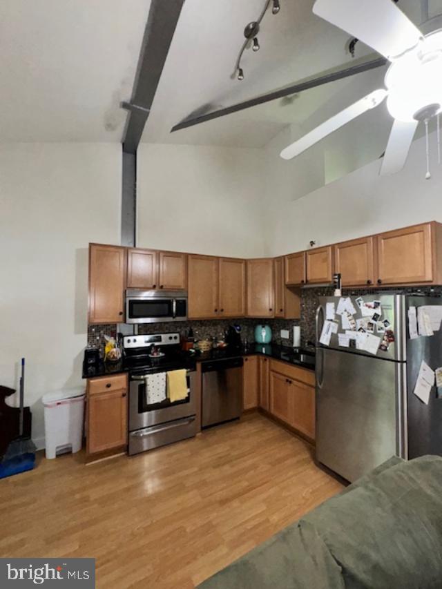 85 Valley Road, Unit 3 Phoenixville, PA 19460 - Photo 11 of 34 a kitchen with stainless steel appliances kitchen island granite countertop a stove and a refrigerator