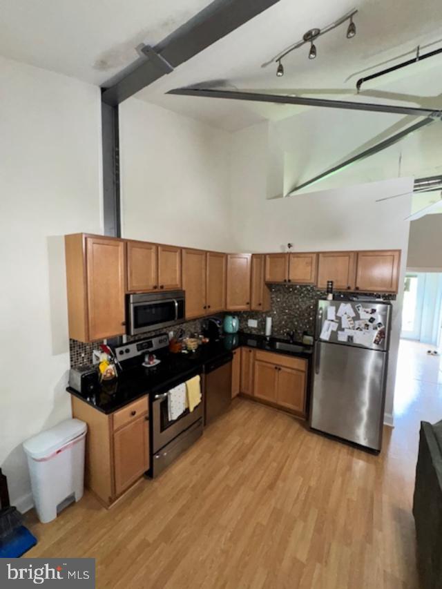 85 Valley Road, Unit 3 Phoenixville, PA 19460 - Photo 12 of 34 a kitchen with stainless steel appliances granite countertop a stove a sink and a refrigerator