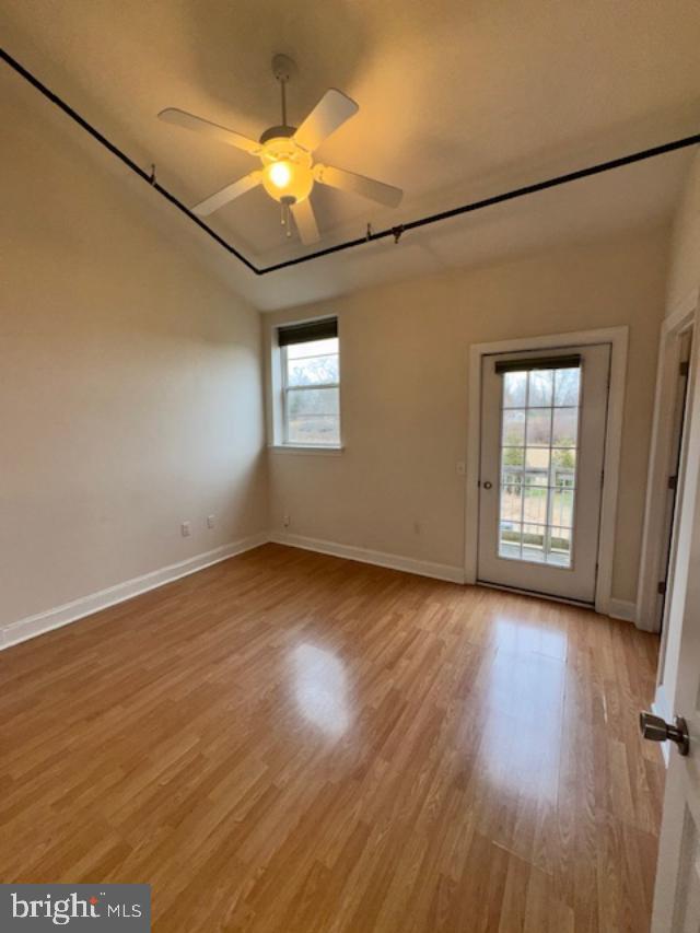 85 Valley Road, Unit 3 Phoenixville, PA 19460 - Photo 20 of 34 an empty room with wooden floor and windows