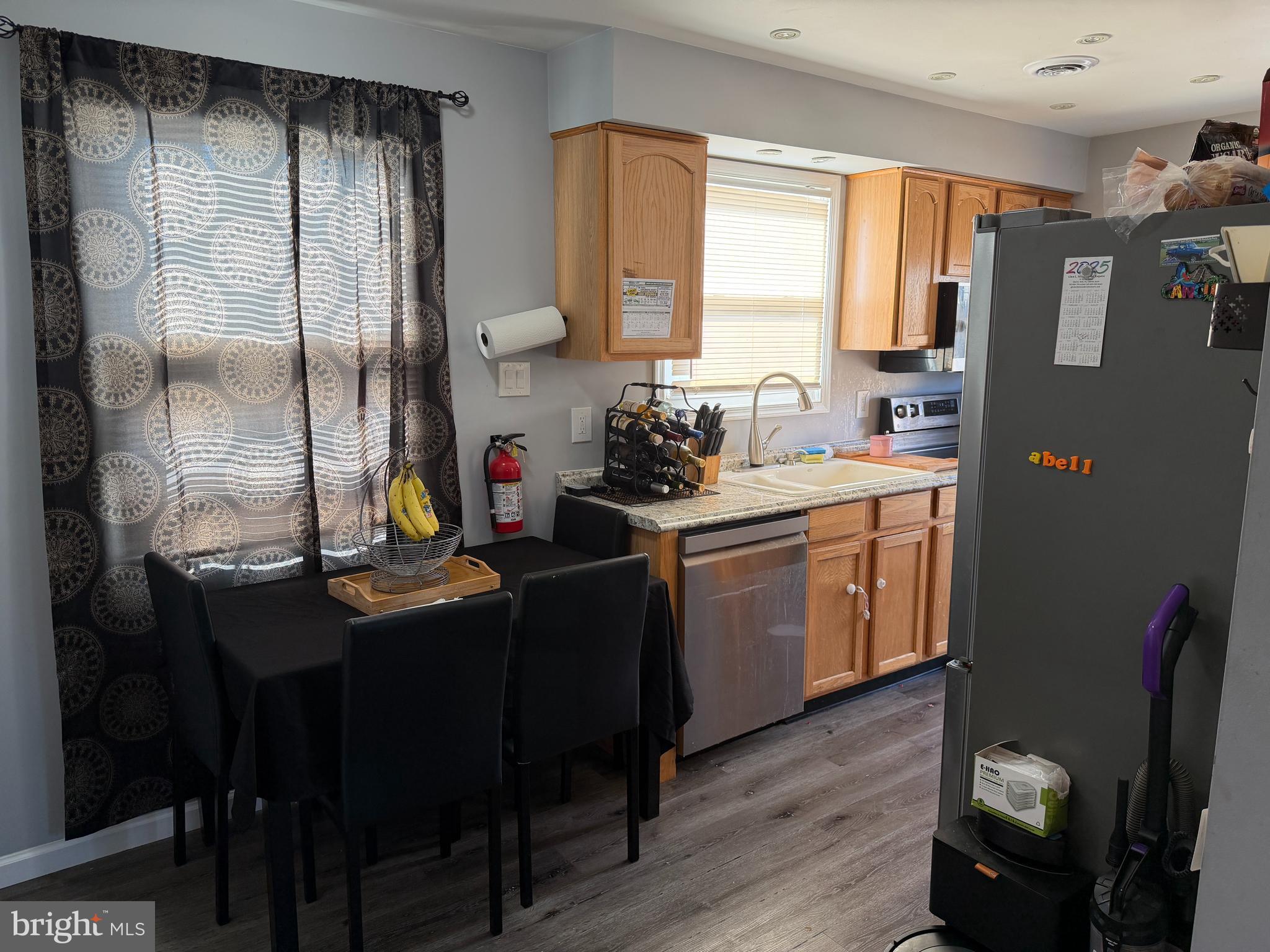 127 Dory Court Beverly, NJ 08010 - Photo 5 of 16 a kitchen with a sink appliances cabinets and dining table