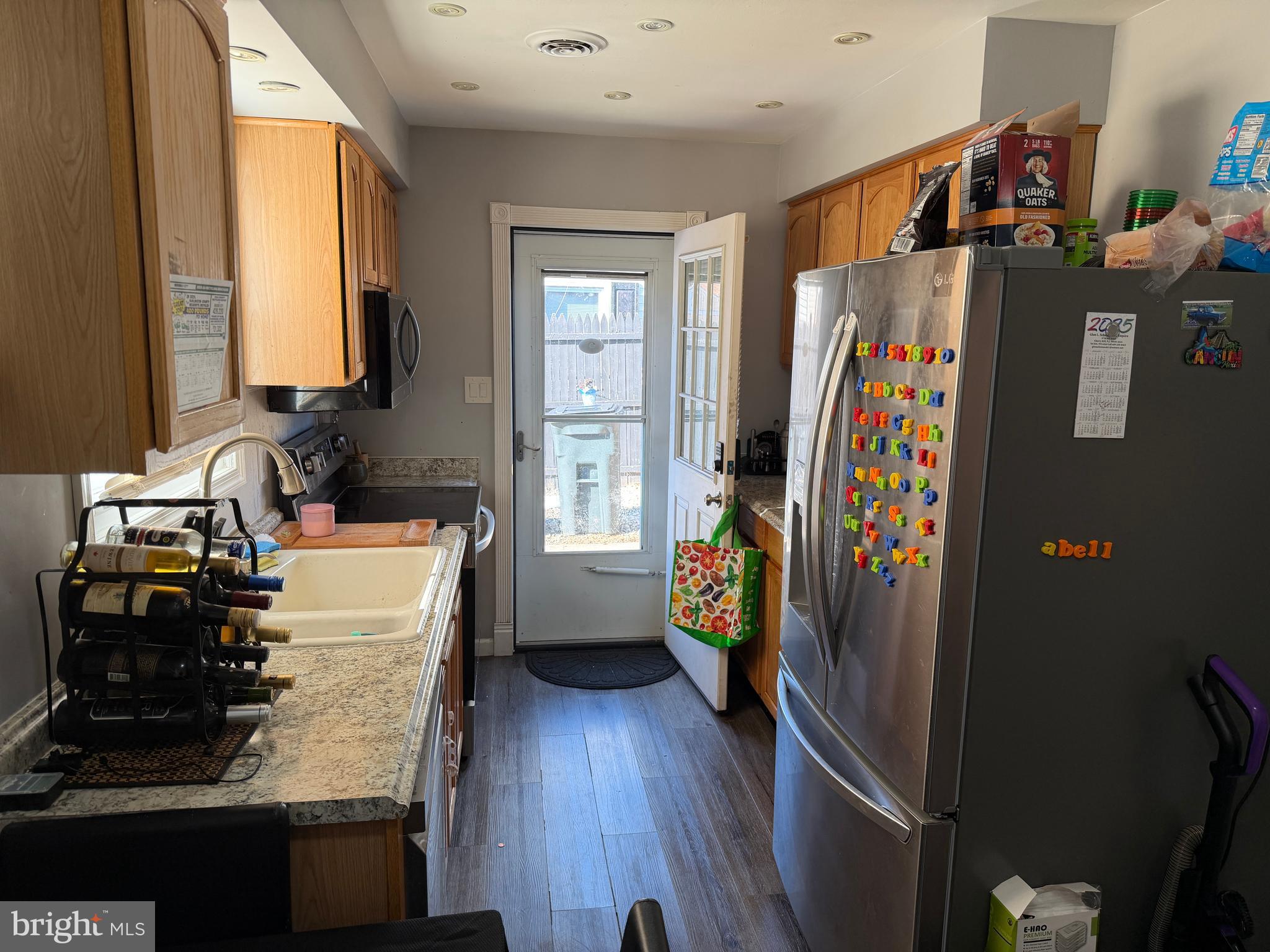 127 Dory Court Beverly, NJ 08010 - Photo 6 of 16 a kitchen with stainless steel appliances granite countertop a refrigerator and a sink
