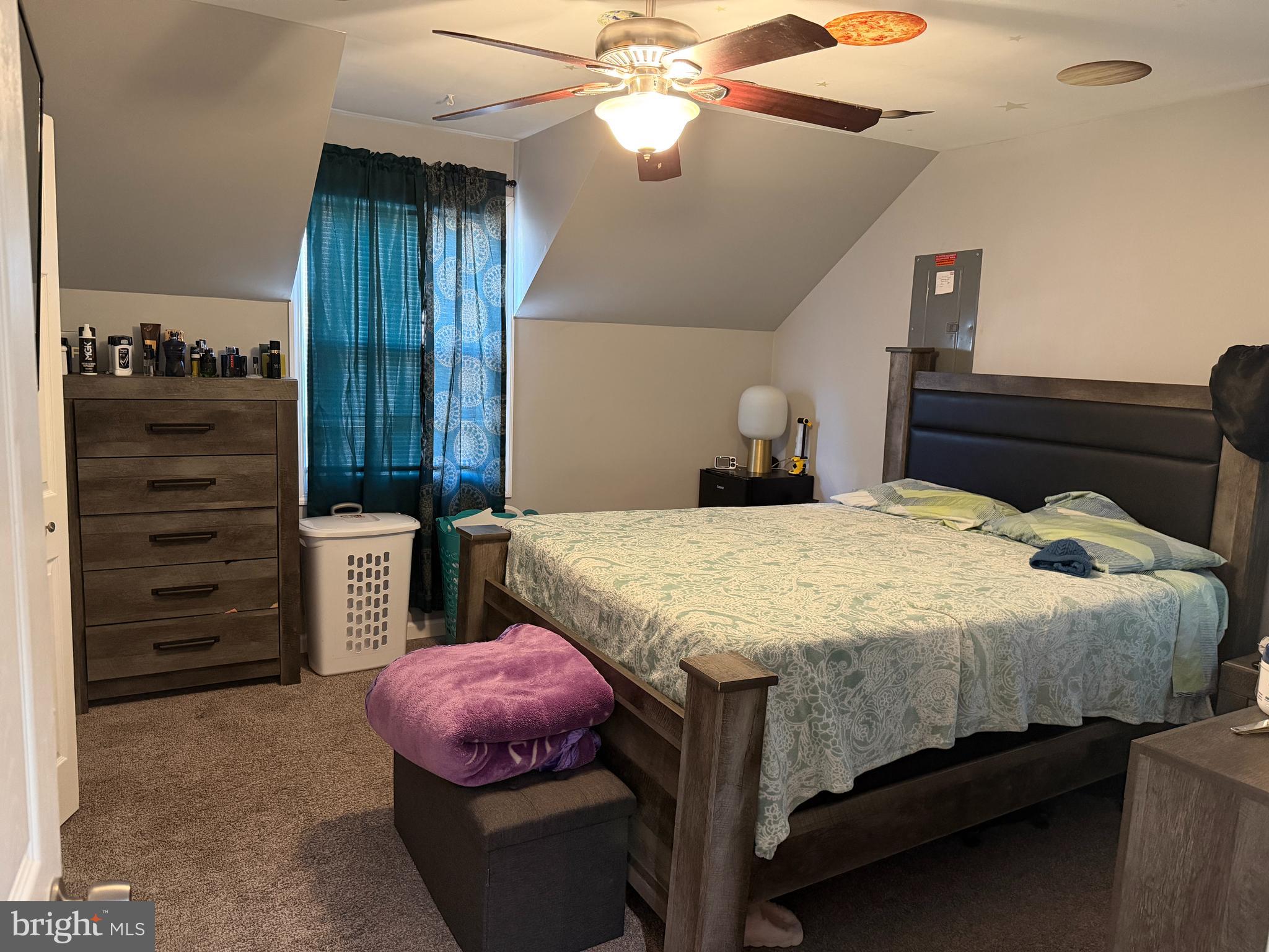 127 Dory Court Beverly, NJ 08010 - Photo 7 of 16 a spacious bedroom with a bed and a chandelier