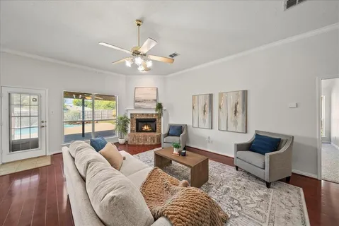a living room with furniture and a fireplace