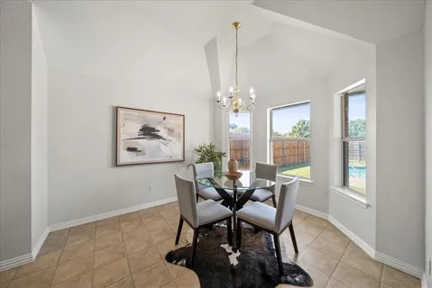 a kitchen with stainless steel appliances granite countertop a stove a sink dishwasher and a refrigerator