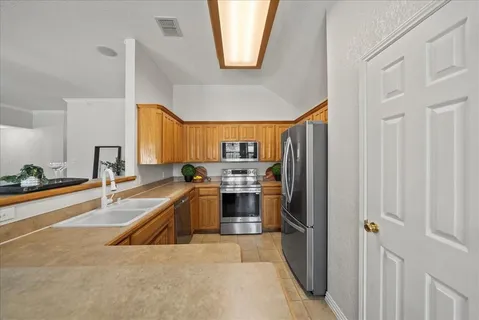 a kitchen with a sink and a microwave