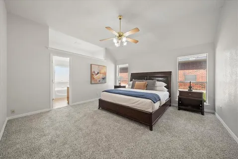 a bedroom with a bed and lamp