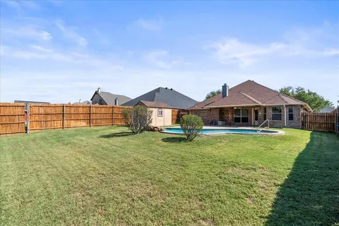 a view of a house with swimming pool and porch